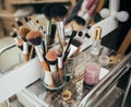 Make-up brushes and cosmetic on dressing table Royalty Free Stock Photo