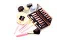 make-up brushes in holder and cosmetics