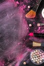 Make-up brushes, pearls, lipstick, top shot on a dark background Royalty Free Stock Photo