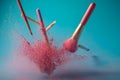 Make up brushes with powder splashes isolated on pink background Royalty Free Stock Photo