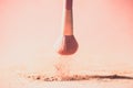 Make up brushes with powder splashes isolated on pink background Royalty Free Stock Photo