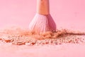Make up brushes with powder splashes isolated on pink background Royalty Free Stock Photo
