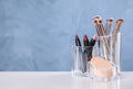 Make up brushes on white table. Space for text Royalty Free Stock Photo