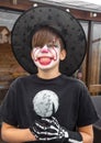 Make up clown boy with hat and carnival costume