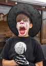 Make up clown boy with hat and carnival costume