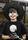 Make up clown boy with hat and carnival costume