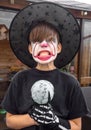 Make up clown boy with hat and carnival costume