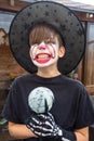 Make up clown boy with hat and carnival costume