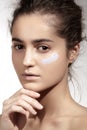 Make-up & cosmetics. Beautiful model with clean skin, foundation concealer cream Royalty Free Stock Photo