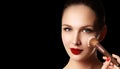 Make-up and cosmetics. Beauty woman face isolated on black backg Royalty Free Stock Photo