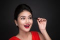 Make-up and cosmetics concept. Asian woman doing her makeup eyelashes black mascara. Royalty Free Stock Photo