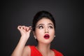 Make-up and cosmetics concept. Asian woman doing her makeup eyelashes black mascara. Royalty Free Stock Photo