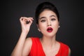 Make-up and cosmetics concept. Asian woman doing her makeup eyelashes black mascara. Royalty Free Stock Photo