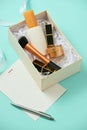 Make up gift box with serum, blush, brushes, cream and lipsticks indoors Royalty Free Stock Photo