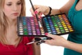 Make-up girl showing range of collors