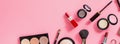 Make up items on pink color background. Horizontal web banner. Set of luxury decorative cosmetics flat lay, top view, mockup, Royalty Free Stock Photo