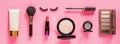 Make up items on pink color background. Horizontal web banner. Set of luxury decorative cosmetics flat lay, top view, mockup, Royalty Free Stock Photo