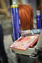 Make up kit. Palettes of eye shadow close up with hairspray on background Royalty Free Stock Photo