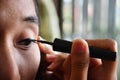 Make up Lifestyle Thai woman use eyeliner Royalty Free Stock Photo