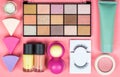 Make up, nails and face care cosmetics set with soft colors on pink background Royalty Free Stock Photo