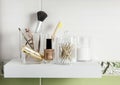 Make up products organizing in bathroom concept. Beauty products in organizer container box on tidy way on minimalist shelf. Cotto Royalty Free Stock Photo