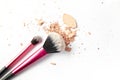 Make-up two brushes and crushed powder isolated on white background Royalty Free Stock Photo