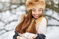 Make a wish! Excited beautiful winter girl with eyes closed. Clo