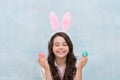 Make a wish. Girl with Easter eggs and bunny. Happy easter. Pretty little girl preparing for Easter. easter egg hunt