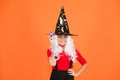 Make wish. supernatural charmer. kid enchantress wave magic wand. happy halloween. believe in magic. smiling small girl Royalty Free Stock Photo