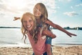 Make you childs childhood memorable. a young woman and her daughter spending some quality time at the beach. Royalty Free Stock Photo