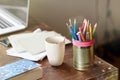Make your creative space work for you. A desk with pencils, a cup and greeting cards. Royalty Free Stock Photo