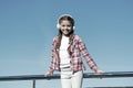 Make your kid happy with best rated kids headphones available right now. Girl child listen music outdoors with modern