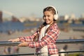 Make your kid happy with best rated kids headphones available right now. Girl child listen music outdoors with modern