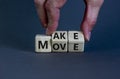 Make your move symbol. Businessman turns wooden cubes with words `Make move`. Beautiful grey background. Make your move and Royalty Free Stock Photo