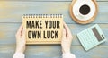 Make Your Own Luck hands holding a card with Royalty Free Stock Photo