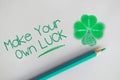 Make your own luck motivational quote with four leaf clover as lucky symbol