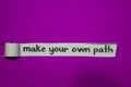 Make Your Own Path, Inspiration, Motivation and business concept on purple torn paper