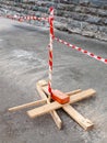 Makeshift fence with red white ribbon