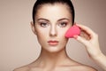 Makeup artist applies skintone Royalty Free Stock Photo