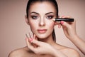 Makeup artist applies skintone Royalty Free Stock Photo