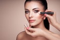 Makeup artist applies skintone Royalty Free Stock Photo