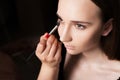 Makeup artist applying a concealer on a model Royalty Free Stock Photo