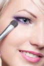 Makeup artist applying eyeshadow