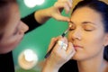 Makeup artist applying eyeshadow Royalty Free Stock Photo