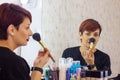 Makeup artist applying make up in beauty salon Royalty Free Stock Photo