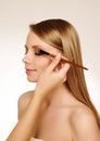 Makeup artist applying mascara Royalty Free Stock Photo