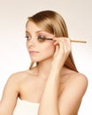 Makeup artist applying mascara Royalty Free Stock Photo