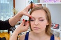 Makeup artist applying mascara on womans eyes Royalty Free Stock Photo