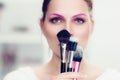 The makeup artist holds powder brushes Royalty Free Stock Photo