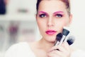 The makeup artist holds powder brushes Royalty Free Stock Photo